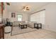Cozy living room with neutral tile flooring, a ceiling fan, ample natural light, and comfortable seating at 111 Beverly Dr, Winter Haven, FL 33884