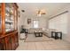 Comfortable living room with neutral tile flooring, a ceiling fan, ample natural light, and comfortable seating at 111 Beverly Dr, Winter Haven, FL 33884