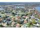 An aerial view of a home nestled in a neighborhood with mature trees and landscaping at 1118 Cypress W Pt, Winter Haven, FL 33884
