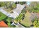 Aerial view of a house with a well-maintained lawn and a spacious driveway at 1118 Cypress W Pt, Winter Haven, FL 33884