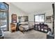 Bedroom featuring decoratively framed posters and a comfortable bed, illuminated by natural light at 1118 Cypress W Pt, Winter Haven, FL 33884