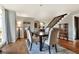 Open concept dining area featuring hardwood floors and easy access to the staircase at 1118 Cypress W Pt, Winter Haven, FL 33884