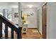 Bright foyer features hardwood floors, stylish console table, and charming decor creating a welcoming entrance at 1118 Cypress W Pt, Winter Haven, FL 33884
