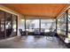 Relaxing screened porch with wicker seating, ideal for outdoor leisure and entertaining at 1118 Cypress W Pt, Winter Haven, FL 33884