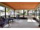 Inviting screened-in porch with wicker furniture, providing a relaxing outdoor living space at 1118 Cypress W Pt, Winter Haven, FL 33884