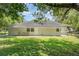 Expansive backyard offers plenty of space for outdoor activities and relaxation under the shade of mature trees at 1125 Josephine St, Lakeland, FL 33815