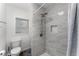Modern bathroom featuring gray tile and a shower with a recessed shelf at 1125 Josephine St, Lakeland, FL 33815