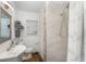 Stylish bathroom features a sleek sink, toilet, and a modern shower with tiled walls at 1125 Josephine St, Lakeland, FL 33815