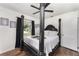 Spacious bedroom with a four-poster bed and a black ceiling fan at 1125 Josephine St, Lakeland, FL 33815