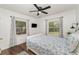 Charming bedroom features dual windows with views and a comfortable bed with blue and white floral bedding at 1125 Josephine St, Lakeland, FL 33815