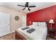 Comfortable bedroom featuring a ceiling fan, a spacious bed, and stylish accents at 1125 Josephine St, Lakeland, FL 33815