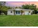 Charming duplex features a well-maintained lawn and inviting curb appeal at 1125 Josephine St, Lakeland, FL 33815