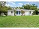 Charming duplex features a well-maintained lawn and inviting curb appeal at 1125 Josephine St, Lakeland, FL 33815