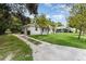 Exterior side view of property showing long driveway and landscaping at 1125 Josephine St, Lakeland, FL 33815
