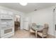 Cozy eat-in kitchen with white appliances, tiled floors, and a view to the living room at 1125 Josephine St, Lakeland, FL 33815