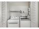 Convenient laundry room with washer, dryer, and additional storage space, perfect for simplifying chores at 1125 Josephine St, Lakeland, FL 33815