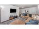Bright living room with hardwood floors, comfy seating, and a flat screen tv at 1125 Josephine St, Lakeland, FL 33815