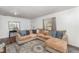 Living room featuring a large sectional sofa, bright natural light, and hardwood floors at 1125 Josephine St, Lakeland, FL 33815