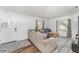 Inviting living room with a cozy sectional sofa, natural light, and a decorative rug at 1125 Josephine St, Lakeland, FL 33815