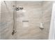 Detailed view of shower featuring neutral tile and built-in storage niche at 1125 Josephine St, Lakeland, FL 33815