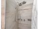 Modern shower features sleek tile, dual shower heads, and built in soap rack for added luxury at 1125 Josephine St, Lakeland, FL 33815