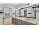 Bathroom with dual sink vanity, large mirror and tile flooring at 118 Caloosa Dr, Babson Park, FL 33827
