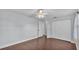 Bedroom with a ceiling fan, hardwood floors, and lots of closet space at 118 Caloosa Dr, Babson Park, FL 33827