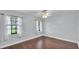 Bright bedroom featuring hardwood floors and natural light at 118 Caloosa Dr, Babson Park, FL 33827