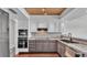 Renovated kitchen features stainless appliances and granite countertops at 118 Caloosa Dr, Babson Park, FL 33827