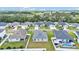 Well-maintained homes with manicured lawns and driveways, located in a peaceful, suburban neighborhood setting at 122 St Thomas Dr, Mulberry, FL 33860