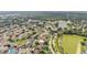 Residential community with curving roads, mature trees, and a serene lake in a lush, green setting at 122 St Thomas Dr, Mulberry, FL 33860