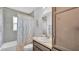 Full bathroom featuring a shower-tub combo and storage shelves for your convenience at 122 St Thomas Dr, Mulberry, FL 33860