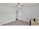 Bedroom with a ceiling fan and carpeted floors, offering a comfortable and neutral space at 122 St Thomas Dr, Mulberry, FL 33860