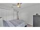 Bedroom featuring a ceiling fan, closet, and a dresser for ample storage space at 122 St Thomas Dr, Mulberry, FL 33860
