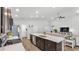 Bright kitchen with stainless steel appliances, a center island, and an open view to the living space at 122 St Thomas Dr, Mulberry, FL 33860