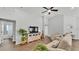 Living room area with doors leading to the bathroom and bedroom with natural light and neutral decor at 122 St Thomas Dr, Mulberry, FL 33860