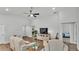 Spacious living room with wood-look flooring, featuring an entertainment center and doorways at 122 St Thomas Dr, Mulberry, FL 33860