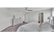 Spacious bedroom with neutral walls and carpet, featuring an elegant dresser and ensuite bathroom at 122 St Thomas Dr, Mulberry, FL 33860