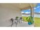 Outdoor patio area with table, chairs and potted plants for cozy outdoor living at 122 St Thomas Dr, Mulberry, FL 33860