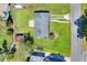 The aerial shows the property with a large lot, driveway, and street, with a yellow border around the property lines at 124 Carolyn Dr, Lakeland, FL 33803