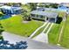 Aerial view of a well-maintained home with a spacious yard and driveway at 124 Carolyn Dr, Lakeland, FL 33803