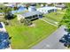 Aerial view of the home showcasing a lush lawn, charming curb appeal, and a well-maintained landscape at 124 Carolyn Dr, Lakeland, FL 33803