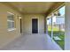 Covered back porch with access to yard and storage at 124 Carolyn Dr, Lakeland, FL 33803