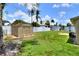 Spacious backyard with a storage shed and privacy fence, perfect for outdoor activities at 124 Carolyn Dr, Lakeland, FL 33803