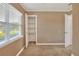 Bedroom featuring closet and doorway access, neutral walls, and window at 124 Carolyn Dr, Lakeland, FL 33803