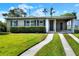 Charming single-story home with a well-manicured lawn and covered parking space at 124 Carolyn Dr, Lakeland, FL 33803