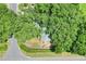 Single Gathering home surrounded by mature trees at 1300 Ariana Woods Cir, Auburndale, FL 33823