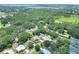 Aerial view of single Gathering homes in a quiet neighborhood near a community park and shopping centers at 1300 Ariana Woods Cir, Auburndale, FL 33823