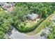 Charming home with mature trees and lush landscaping on a corner lot at 1300 Ariana Woods Cir, Auburndale, FL 33823