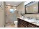 This bathroom boasts a glass-enclosed shower with a rain shower head and elegant vanity at 1300 Ariana Woods Cir, Auburndale, FL 33823